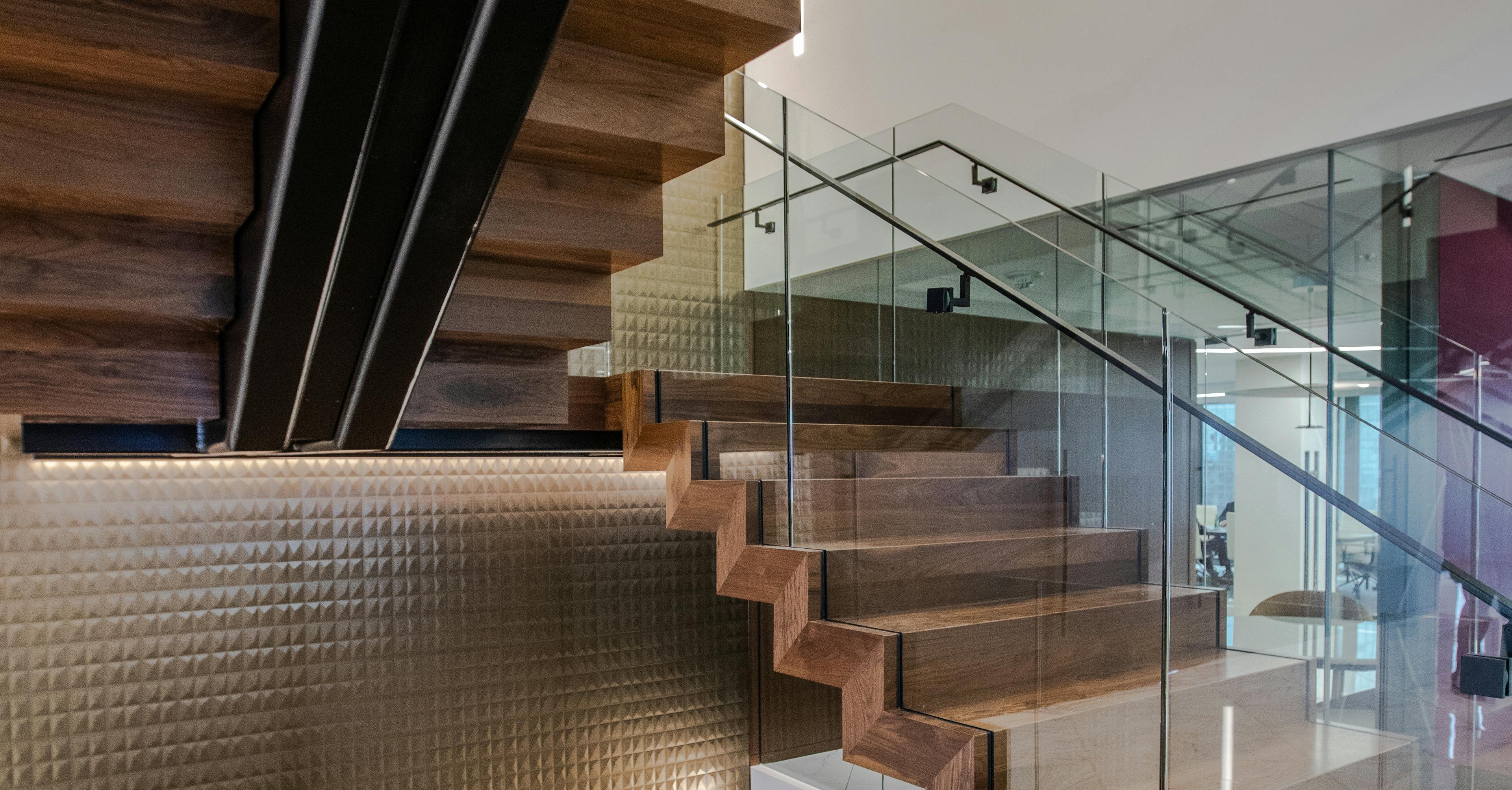Wood staircase with glass railings in Nixon Peabody's San Francisco office