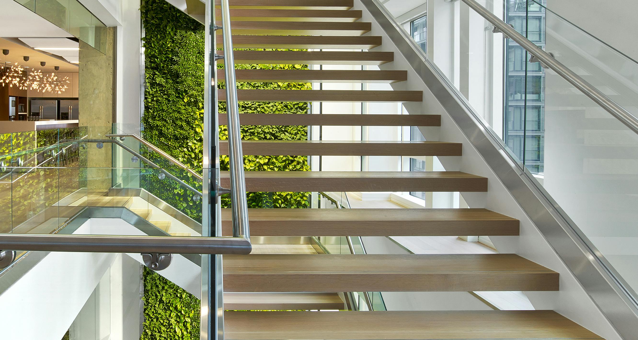 Staircase in Nixon Peabody's DC office, showing the “living wall,” a wall-mounted garden of various plants